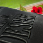 Close-up of raised tonal Fresh Despair lettering