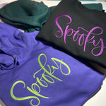 Purple Spooky hoodie beside black Spooky shirt