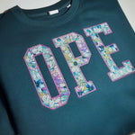 Teal sweatshirt with floral OPE appliqué