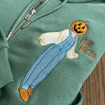 Close-up of scarecrow in blue overalls holding a drink