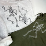 Gray sweatshirt with two dancing skeletons embroidered in dark thread