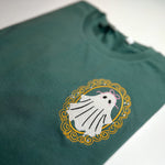 Green shirt with ghost in a gold frame and pink bow