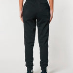Back view of plain black joggers on a model