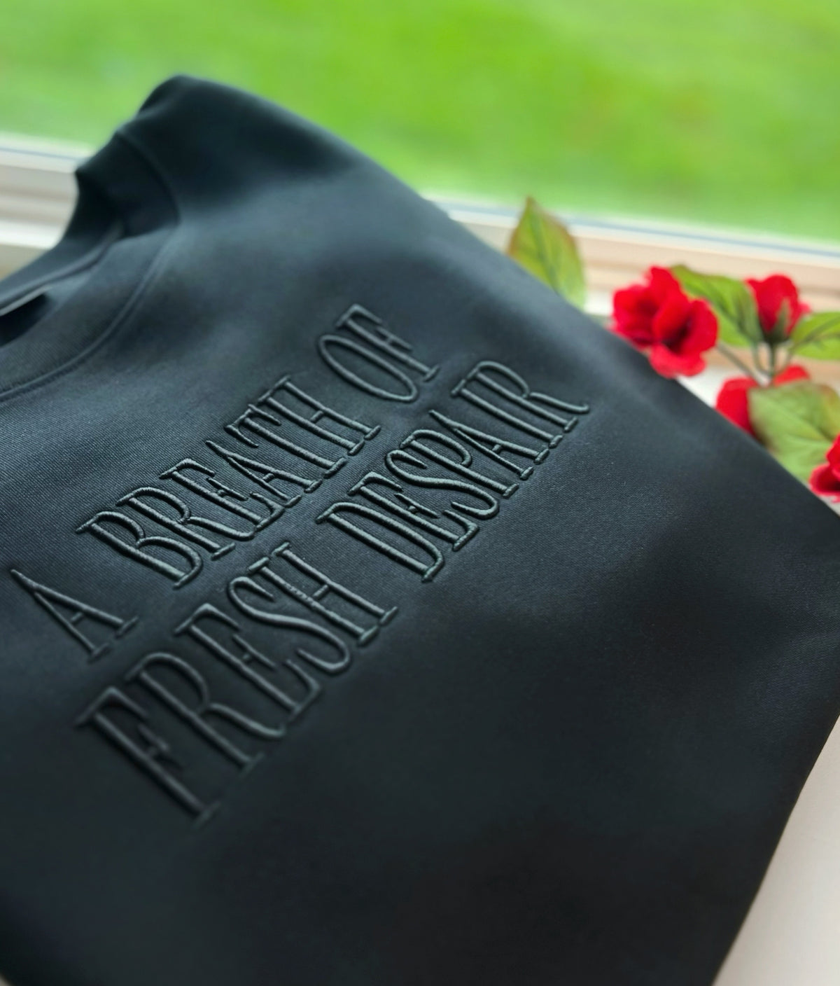 Dark sweatshirt with tonal Breath of Fresh Despair embroidery