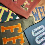 Assorted custom appliqué sweatshirts with OPE, FFS, and WTF letters