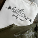 Cream sweatshirt with line-art Halloween embroidery and Spooky Season script