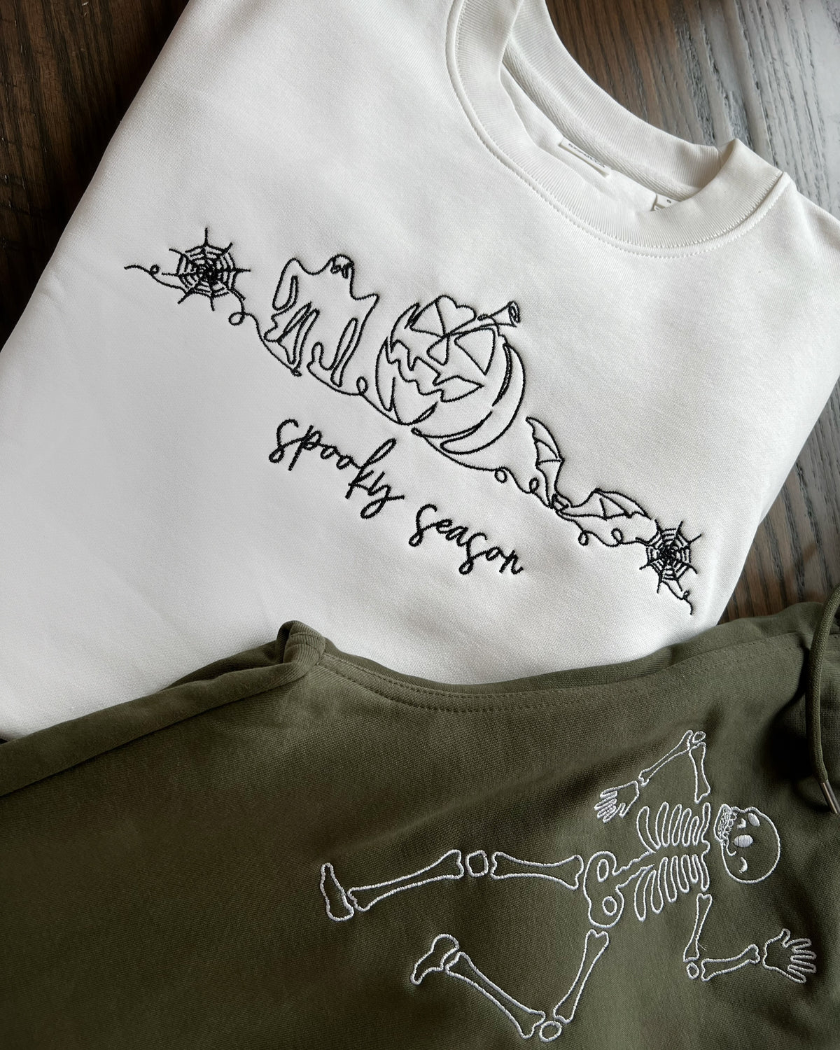 Cream sweatshirt with line-art Halloween embroidery and Spooky Season script