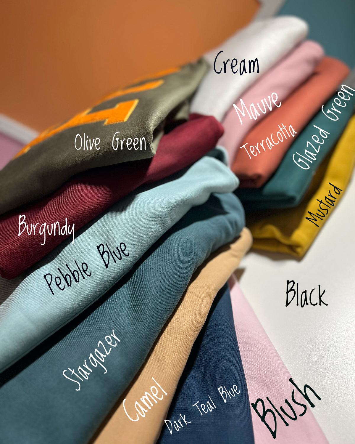 Labeled stack of custom sweatshirt color options
